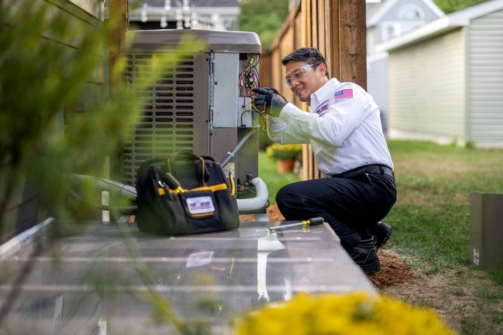 Mike R., HVAC business owner, at an outdoor AC unit